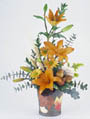 fall arrangement filled with flowers such as fall mums, alstroemeria, and yellow aster.